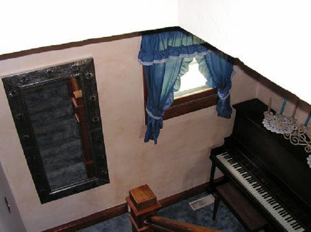 The way upsairs to the bedrooms.  Anyone play the piano?